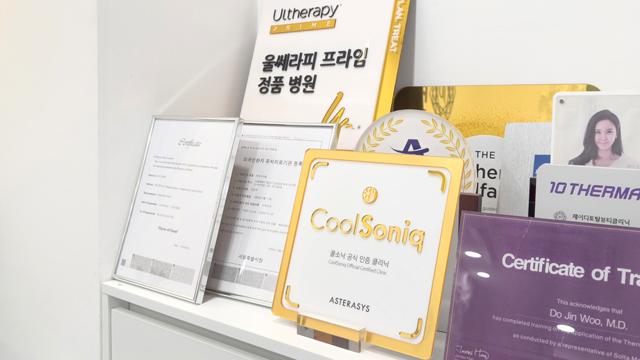Treatment certificates and awards displayed at JD Clinic.