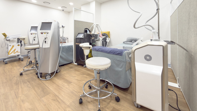 Treatment room at JD Clinic with multiple medical devices.