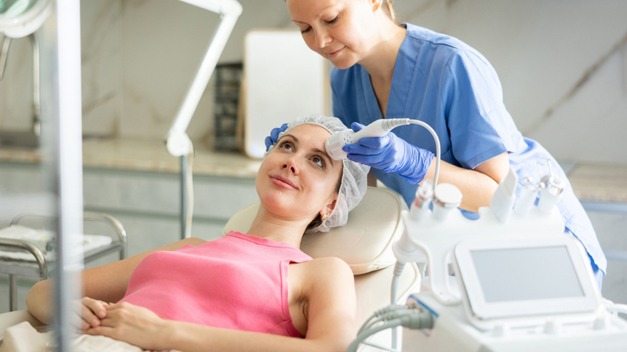 Patient receiving non-surgical skin rejuvenation and anti-aging facial treatment in a medical clinic
