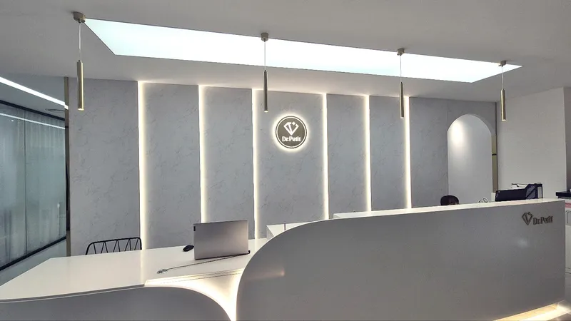 Reception area at Doctorpetit Hongdae with illuminated clinic logo.