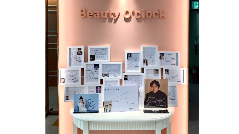 Display wall at Doctorpetit Hongdae with framed photos and autographs.