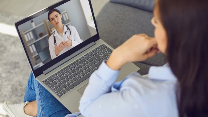 Online Botox consultation: an international patient discusses her concerns with a doctor by video before traveling