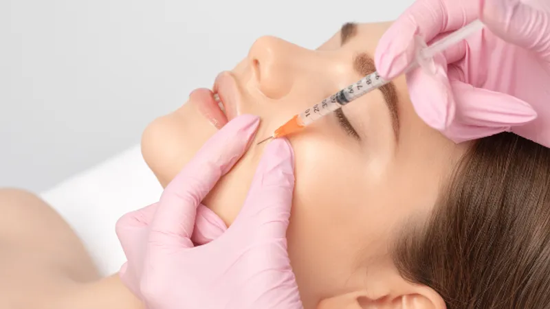 Patient receiving Botox injections on the face.