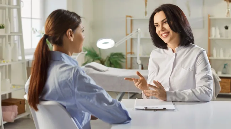 Doctor consulting with a patient about Botox treatment options in a clinic