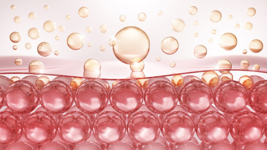 3D illustration of pink skin cells with golden droplets floating above the skin surface.