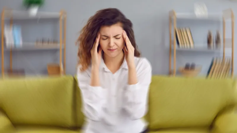 Person experiencing dizziness and balance problems.